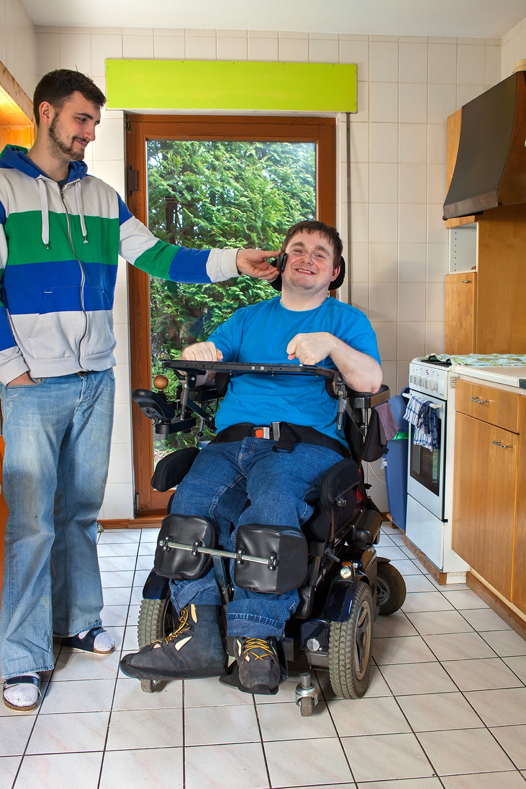 Independent Living Assistant with man in wheelchair in home.jpg