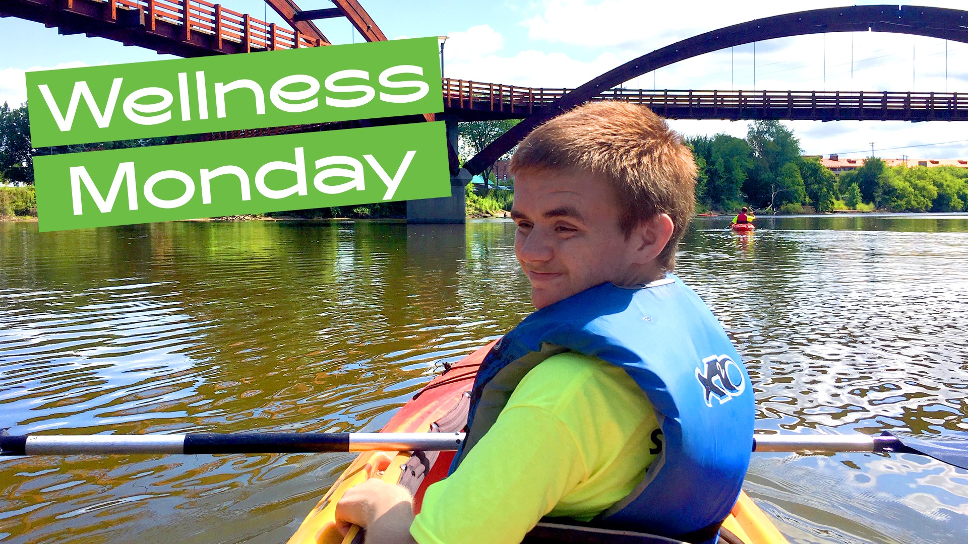 Wellness Monday teen in kayak and The Tridge in Midland