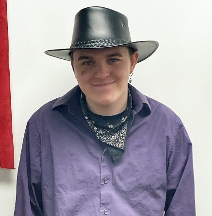 Portrait of young man wearing cowboy hat. Bradley is a Youth Transition Consumer.